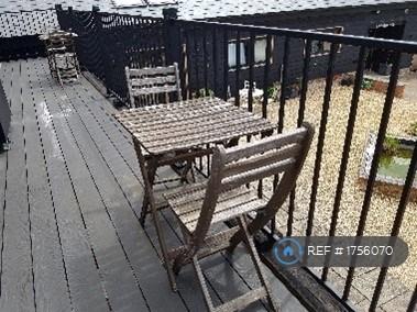 Outside Table And Chairs On Balcony