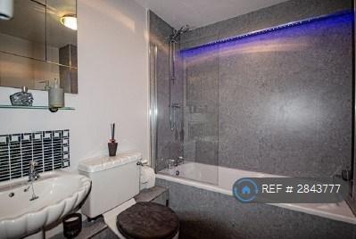 Bathroom With Bath And Over Shower