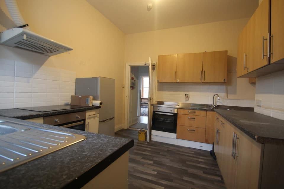 Spacious kitchen with modern cabinets...