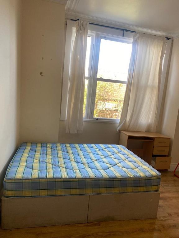 Bright bedroom with double bed and study desk...
