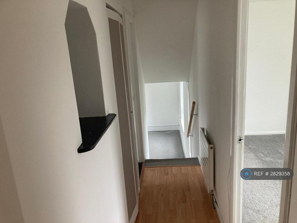 Hallway With Walk In Closet