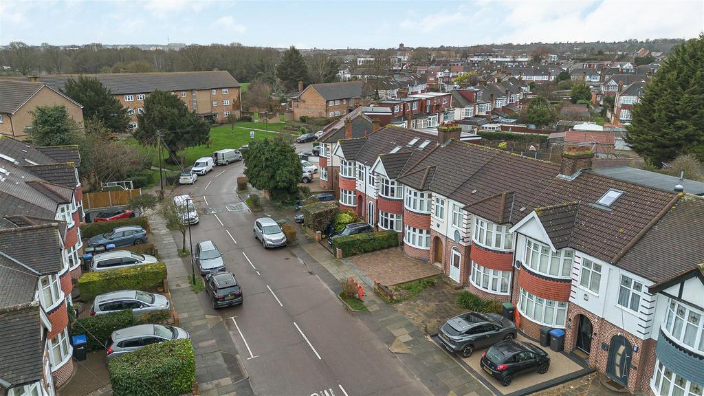 Street scene with property, parking