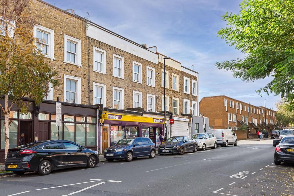 Street scene with property, parking