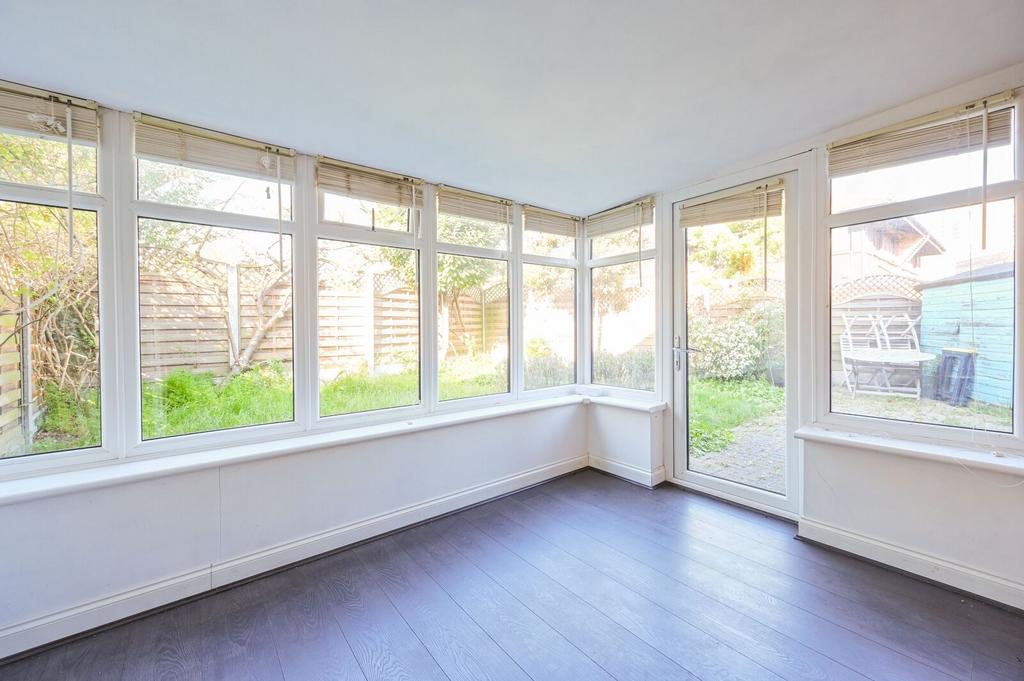 Conservatory interior, french doors leading to garden