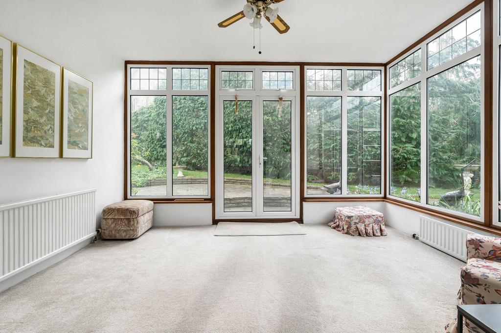 Conservatory interior, french doors leading to garden