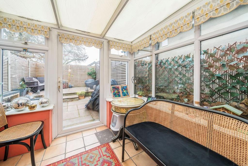 Conservatory interior, french doors leading to garden