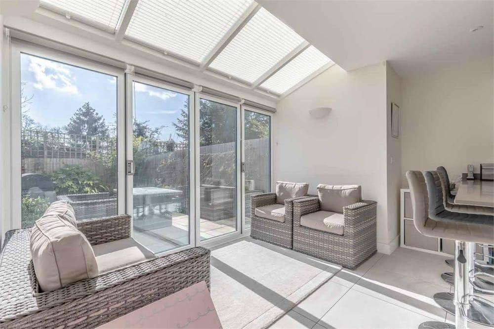 Conservatory interior, french doors leading to garden
