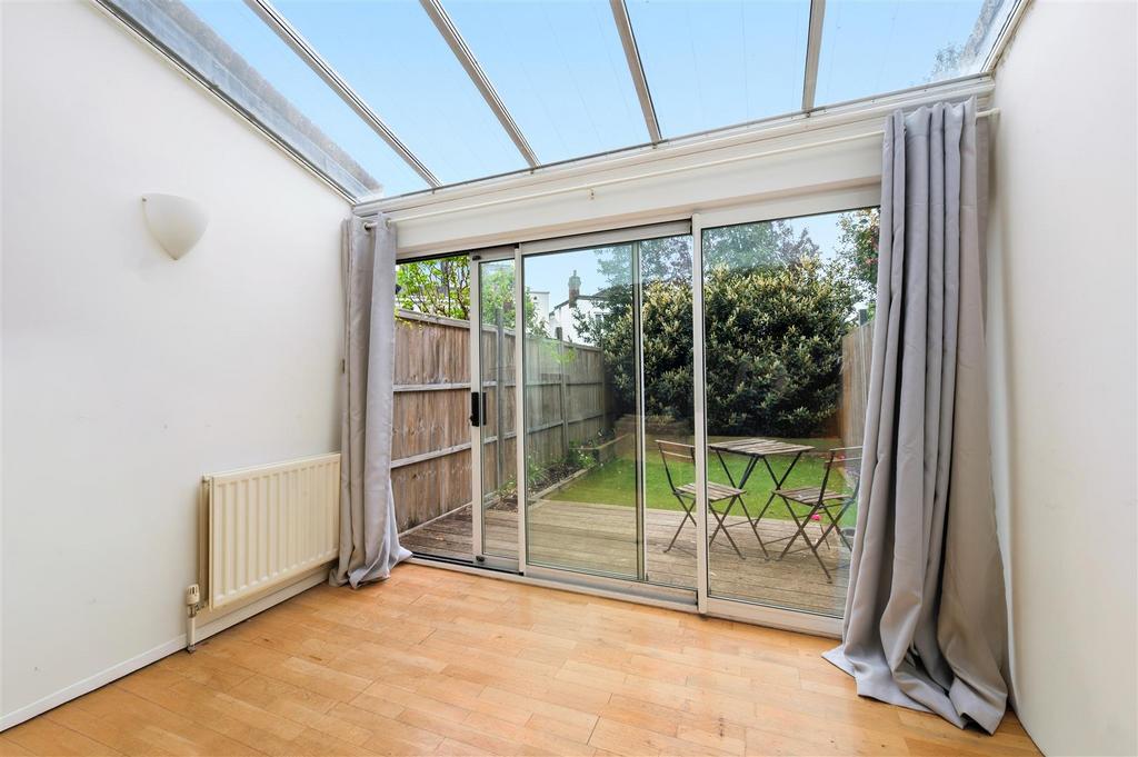 Conservatory interior, french doors leading to garden