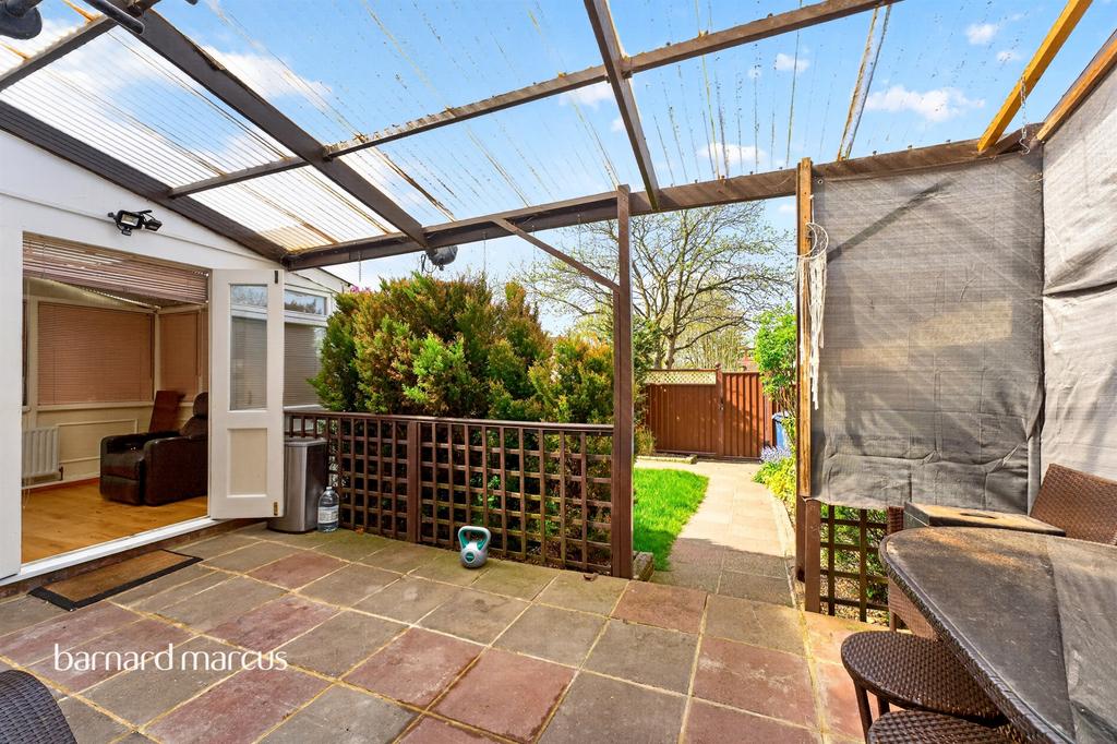Conservatory interior, french doors leading to garden