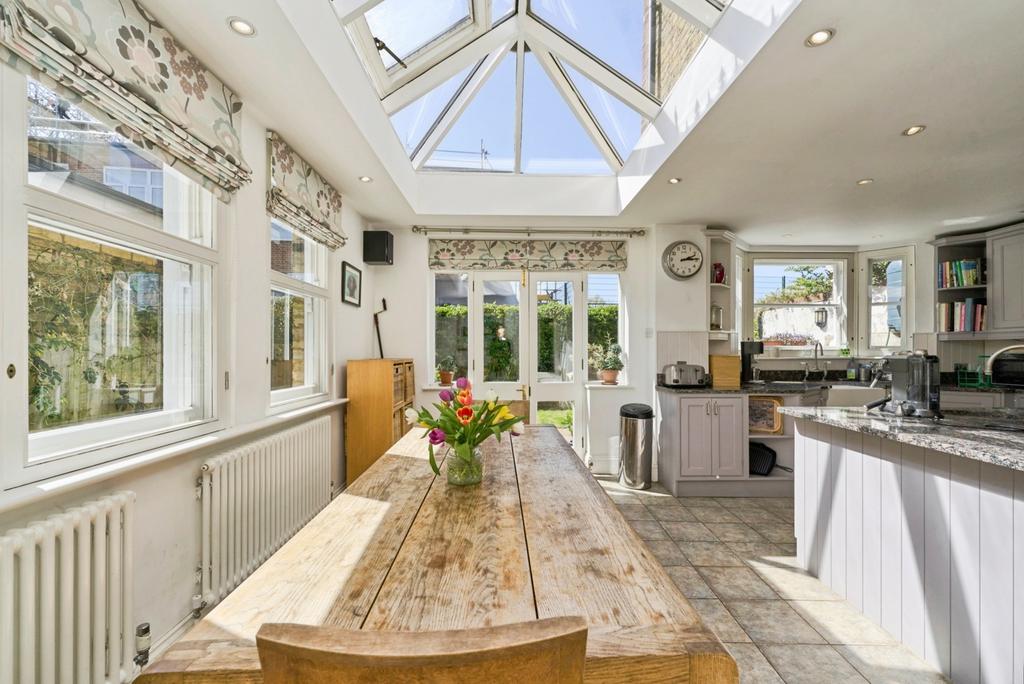 Conservatory interior, french doors leading to garden