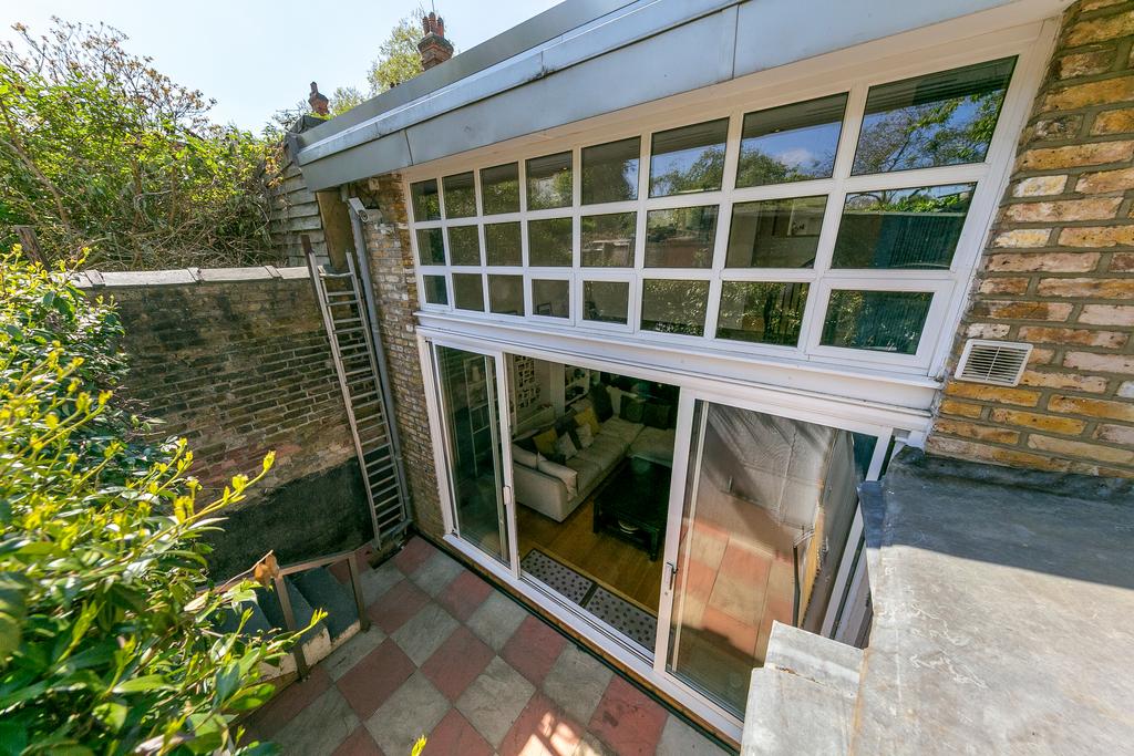 Conservatory interior, french doors leading to garden