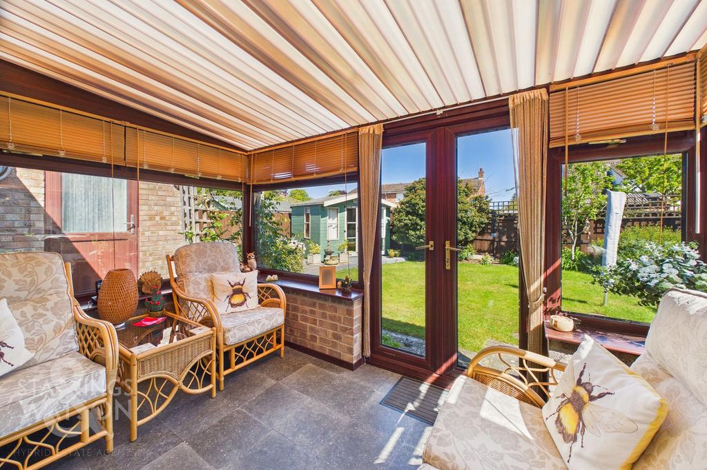 Conservatory interior, conservatory, french doors leading to garden