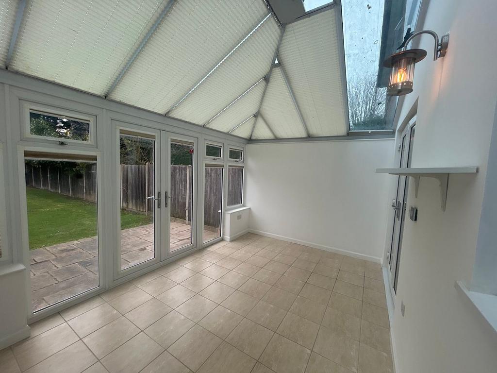 Conservatory interior, conservatory, french doors leading to garden