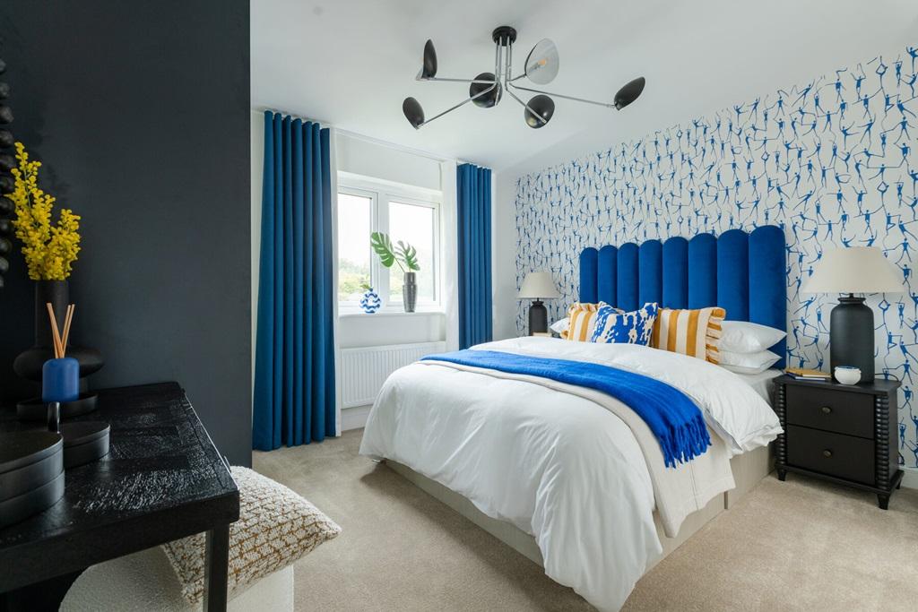 Relax and unwind in the spacious main bedroom...
