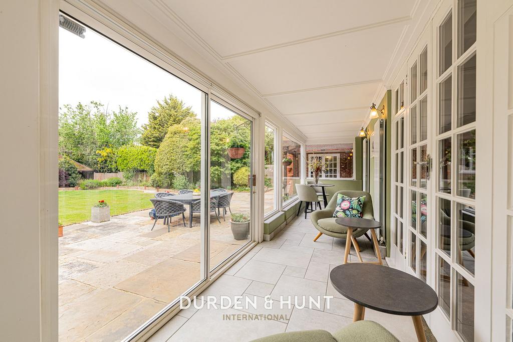 Conservatory interior, french doors leading to garden