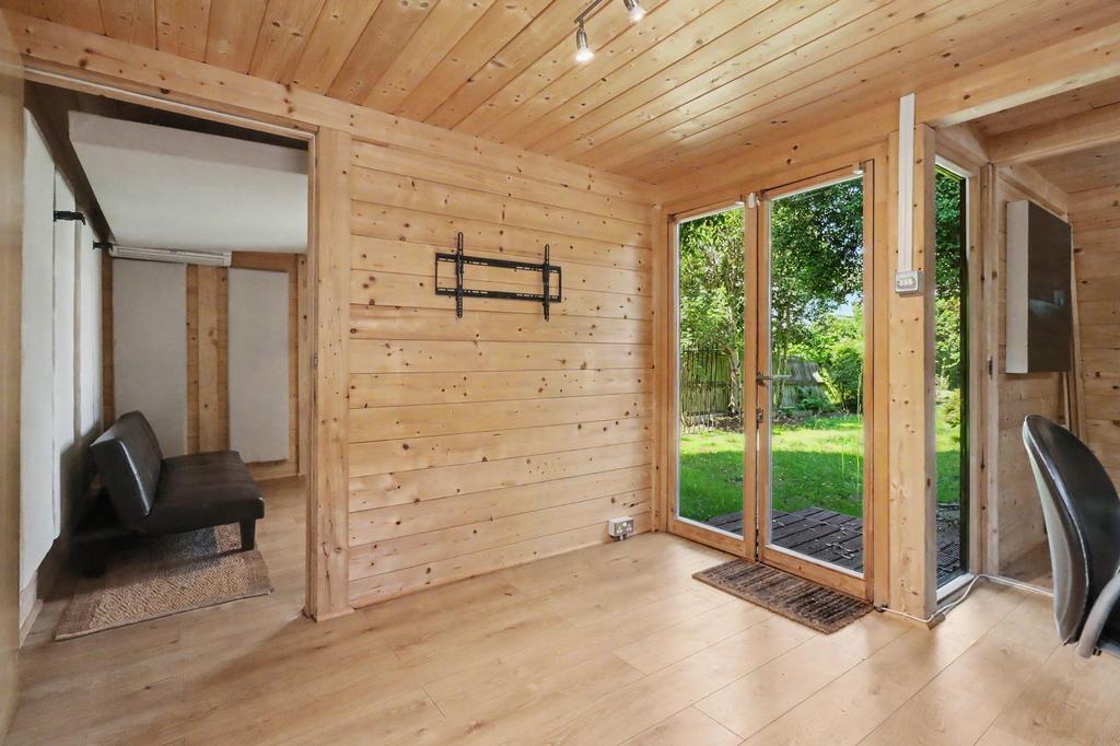 Conservatory interior, french doors leading to garden