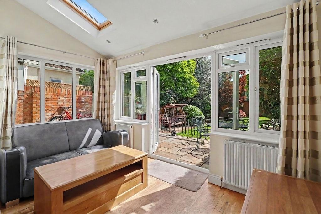 Conservatory interior, french doors leading to garden