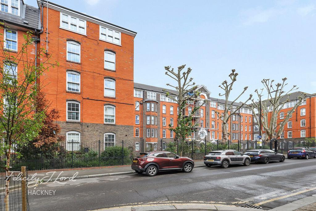 Street scene with property, parking
