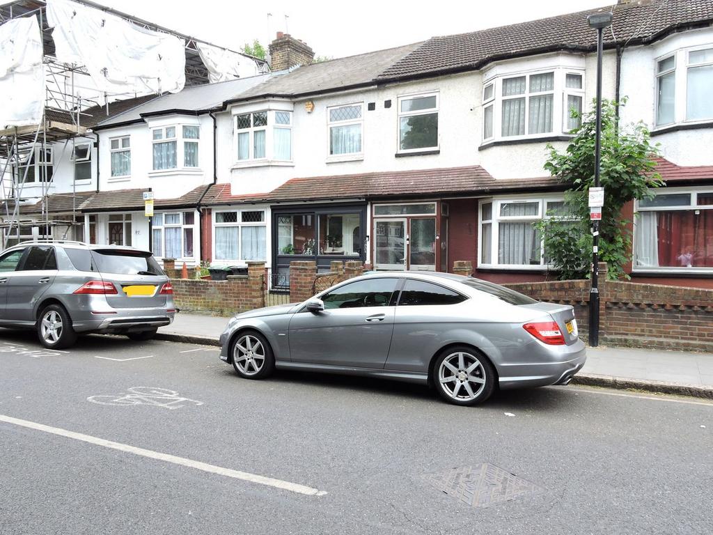 Street scene with property, parking