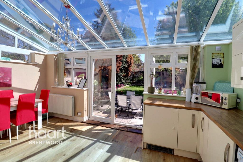 Conservatory interior, conservatory, french doors leading to garden