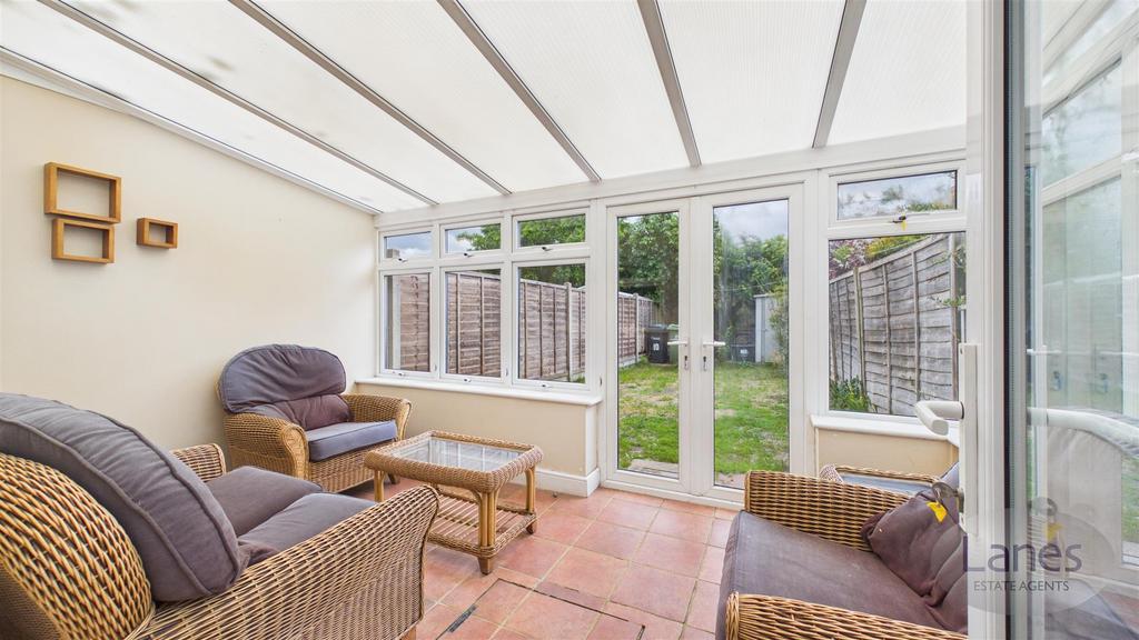 Conservatory interior, conservatory, french doors leading to garden