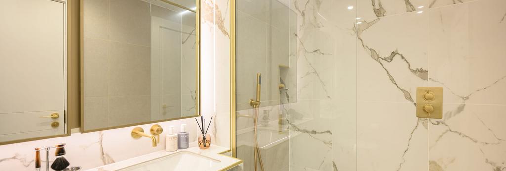 Shower unit with marble style tiles, wash basin...
