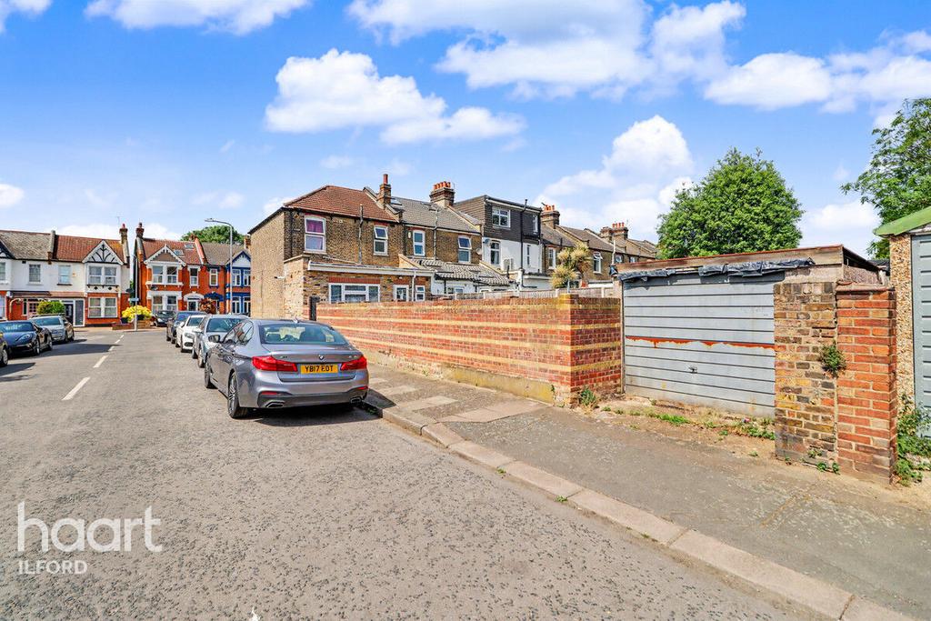 Street scene with property, parking