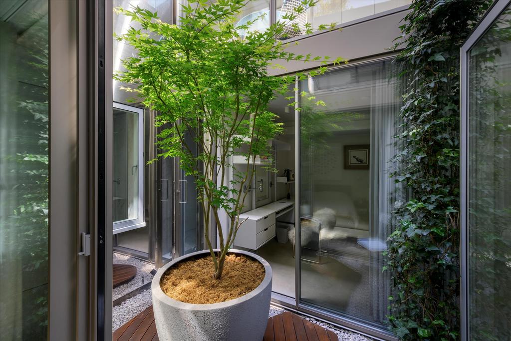 Conservatory interior, french doors leading to garden