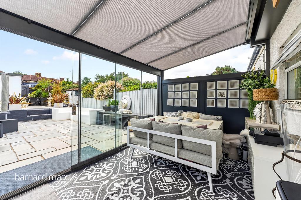 Conservatory interior, french doors leading to garden