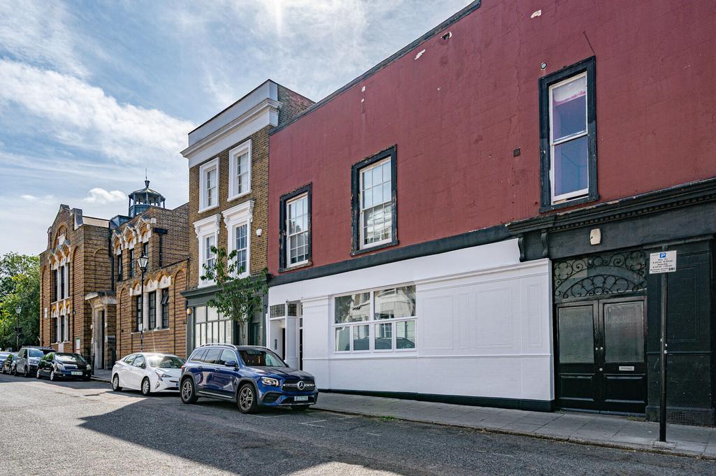 Street scene with property, parking