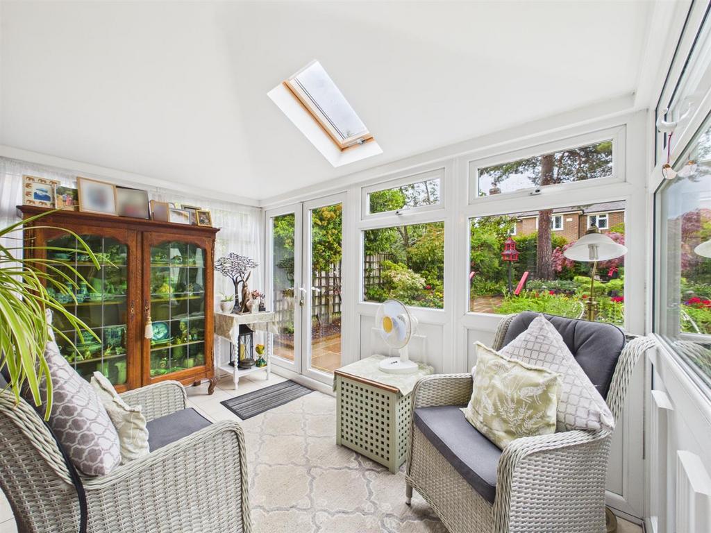 Conservatory interior, french doors leading to garden