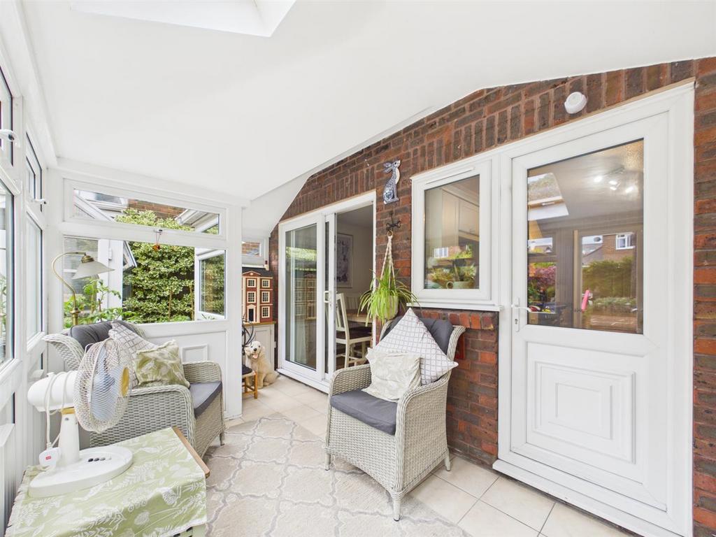Conservatory interior, french doors leading to garden