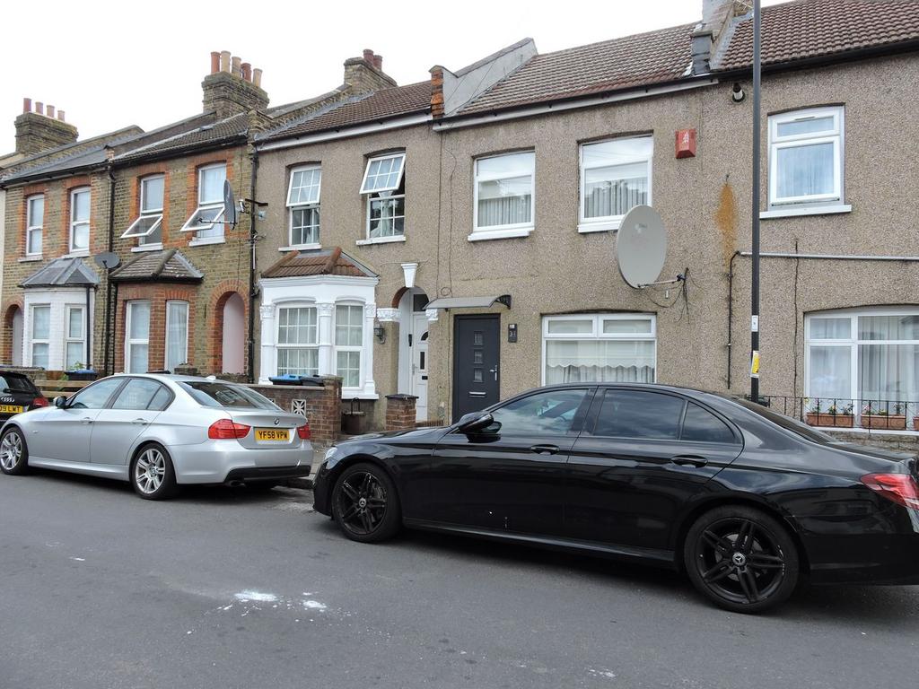 Street scene with property, parking
