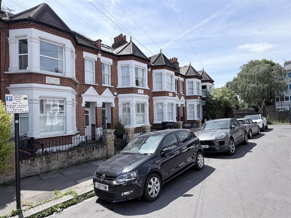 Street scene with property, parking