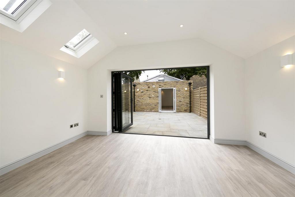 Conservatory interior, french doors leading to garden