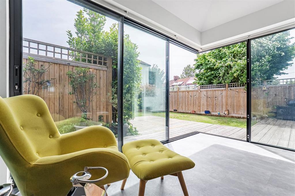 Conservatory interior, french doors leading to garden