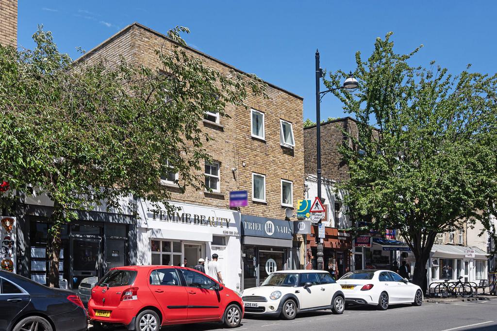 Street scene with property, parking