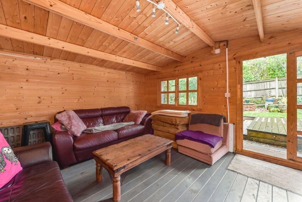 Conservatory interior, french doors leading to garden