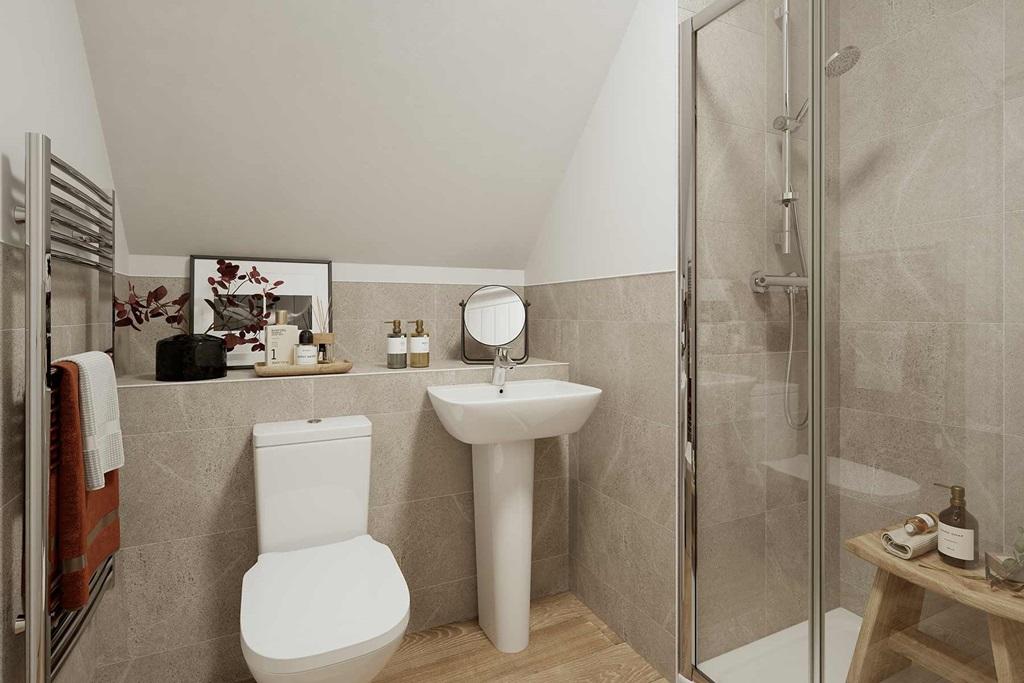 The en suite shower room adds a touch of...