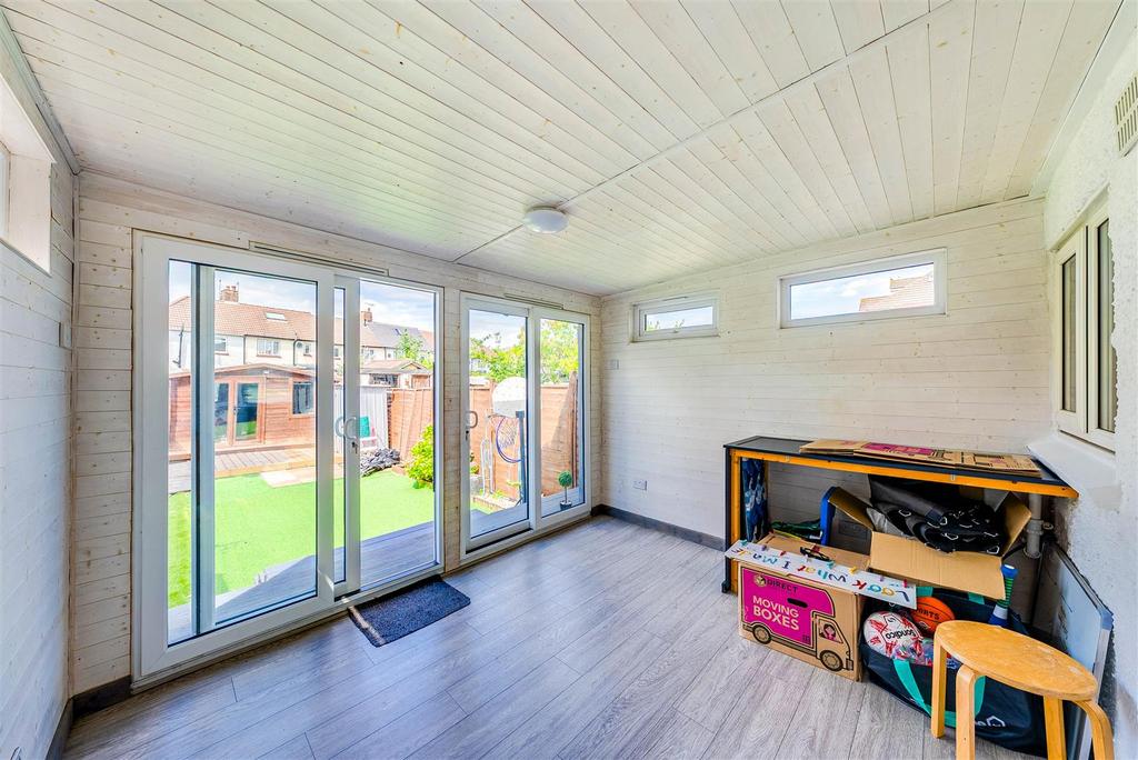 Conservatory interior, french doors leading to garden