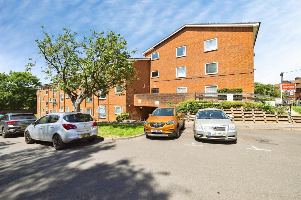 Apartment building facade, block of apartments, parking