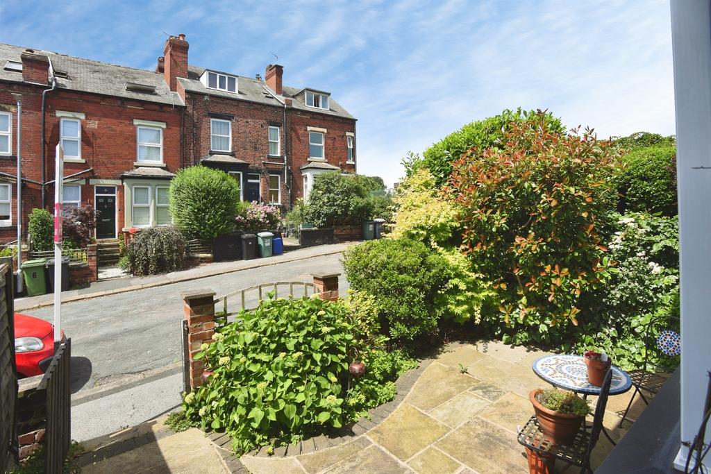 Street scene with property, garden