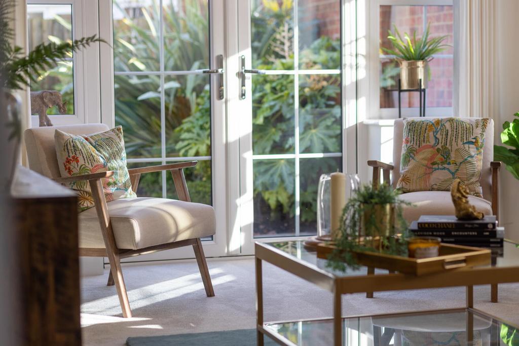 Conservatory interior, french doors leading to garden