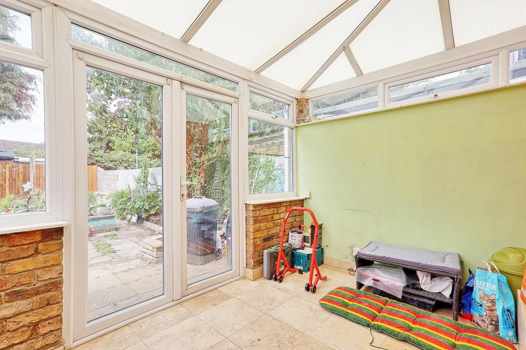 Conservatory interior, conservatory, french doors leading to garden