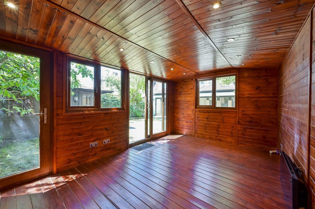 Conservatory interior, french doors leading to garden