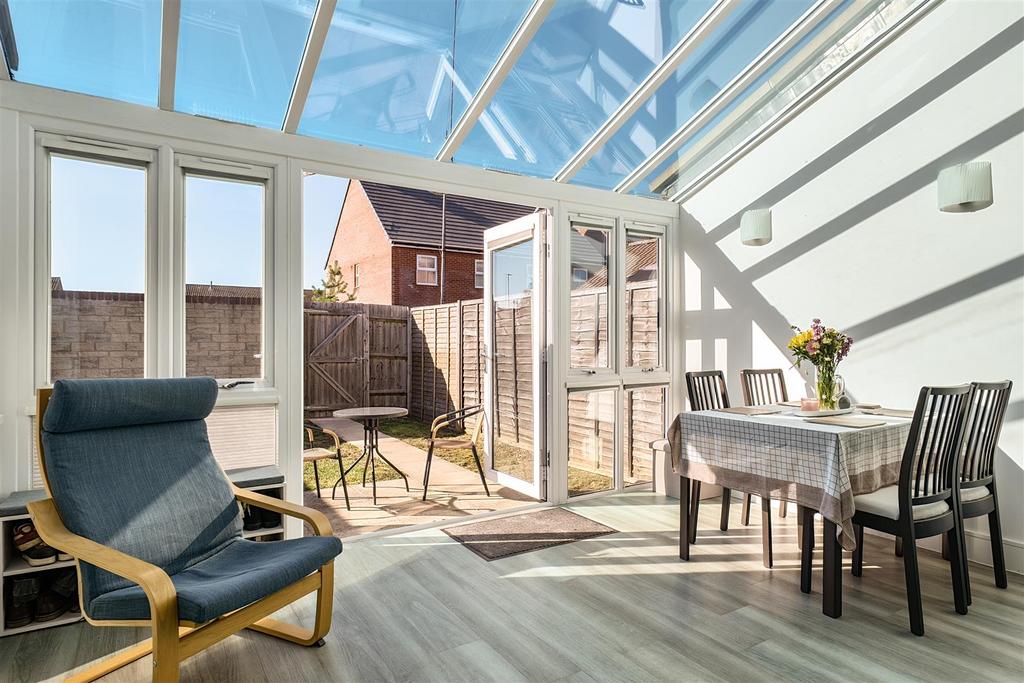 Conservatory interior, conservatory, french doors leading to garden