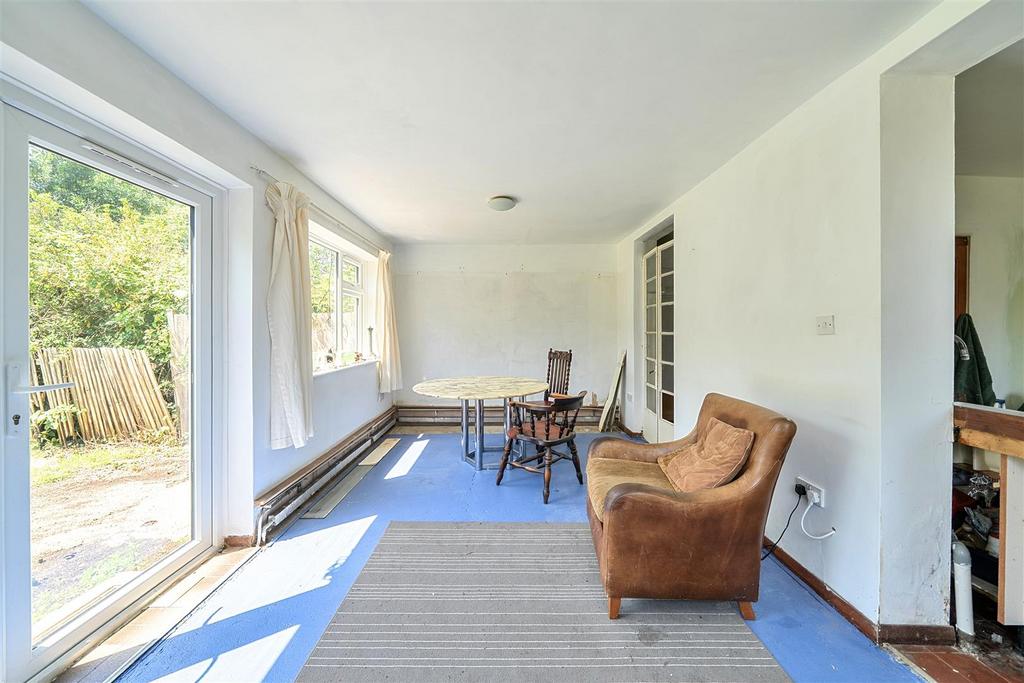 Conservatory interior, french doors leading to garden