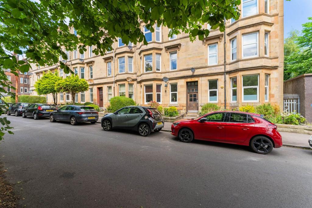 Street scene with property, parking