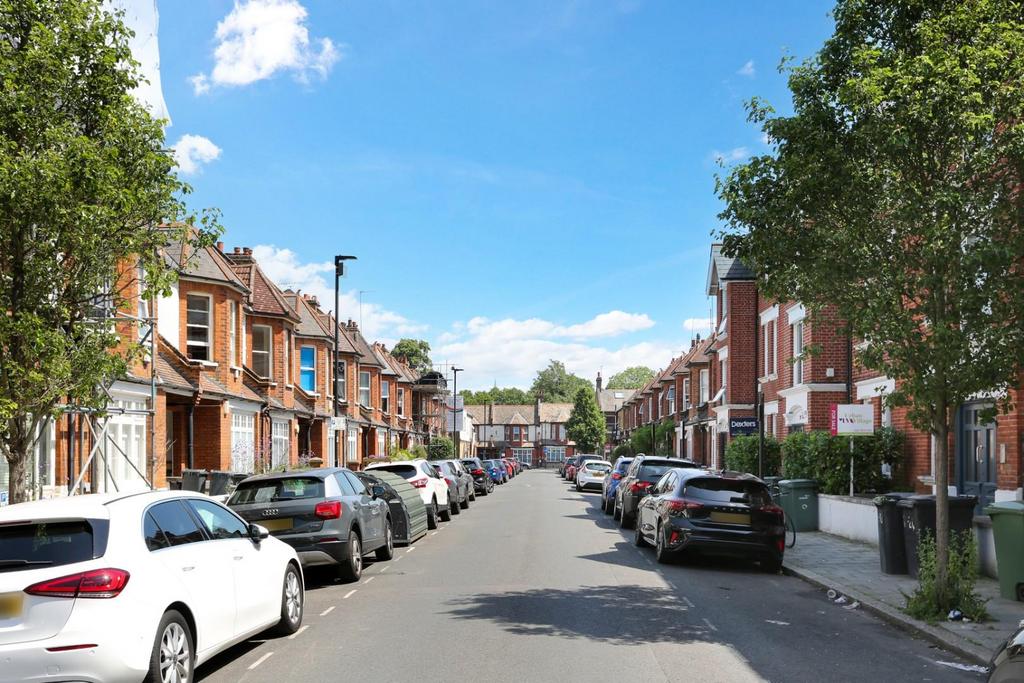 Street scene with property, parking