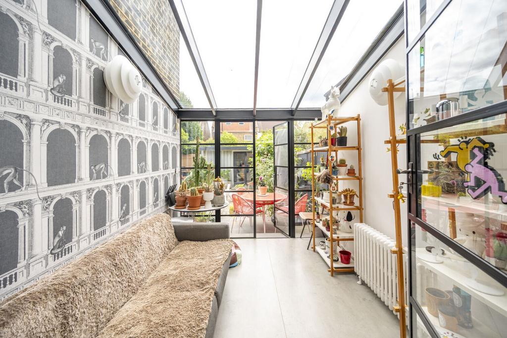 Conservatory interior, french doors leading to garden